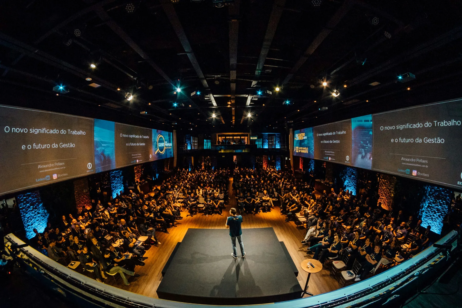 Illustrative business conference with an audience and stage